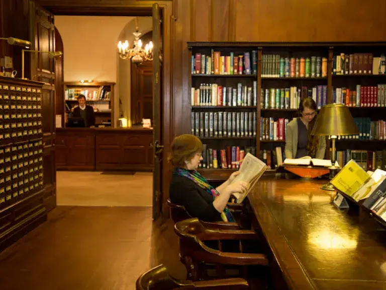 New York Society Library member reading at a table