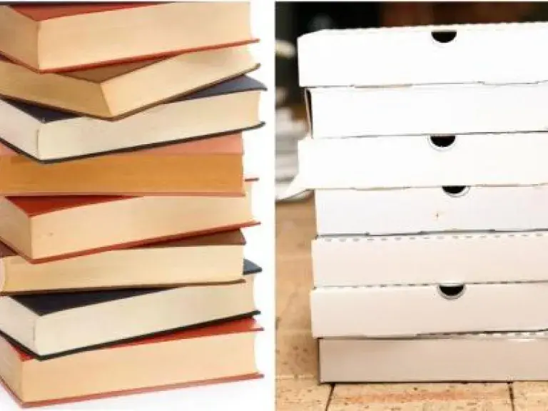 Stack of books and stack of pizza boxes
