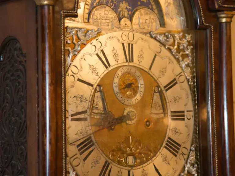 A close-up of the 18th-century clock in the Library's Circulation Hall